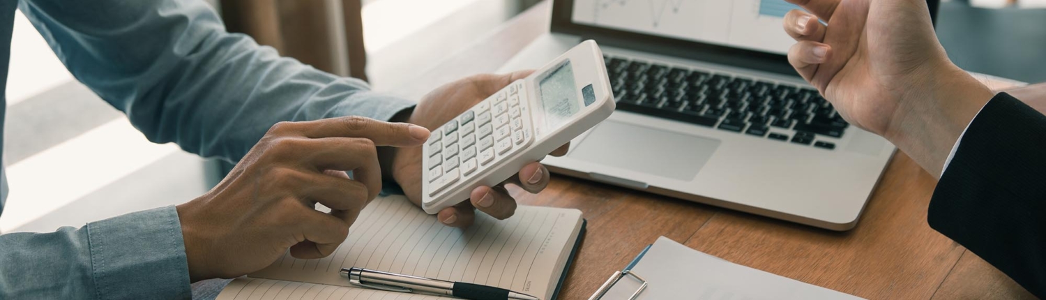 Side view of two people budgeting